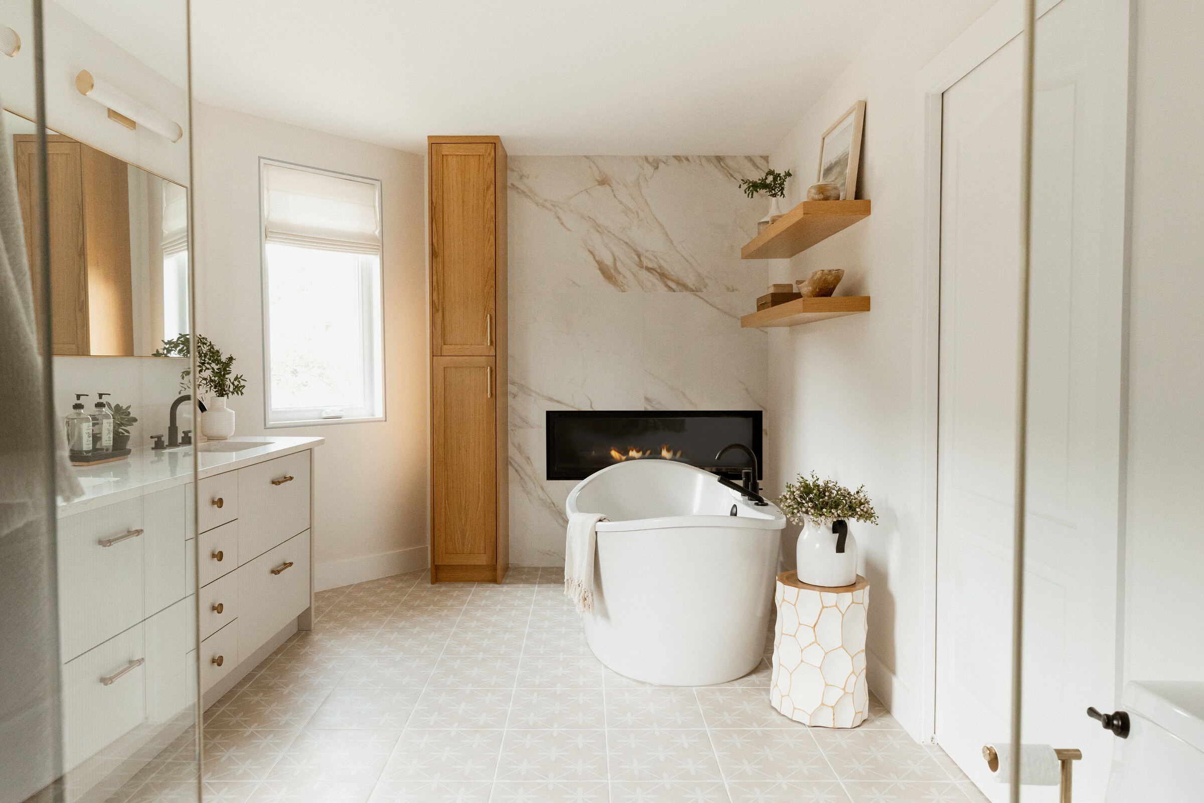 Echo Drive bathroom with a fireplace and freestanding tub